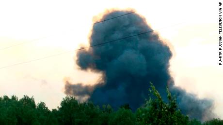 Smoke rises after explosions at a military base near Achinsk, Siberia on Monday, Aug. 5, 2019.