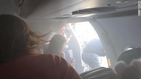 A British Airways cabin filled with smoke during a flight. Passengers described it as a &#39;horror film&#39;