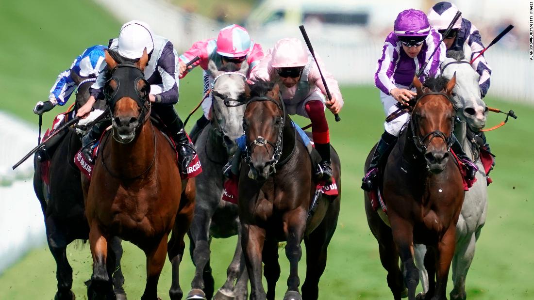 Popular Italian jockey Frankie Dettori rode Too Darn Hot (center, pink) to win the showpiece Qatar Sussex Stakes at Goodwood.