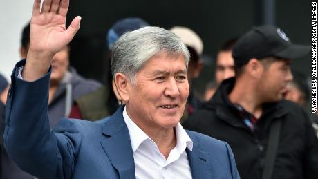 Former Kyrgyzstan&#39;s president Almazbek Atambayev waves to his supporters as he attends a rally in Bishkek, on July 3.