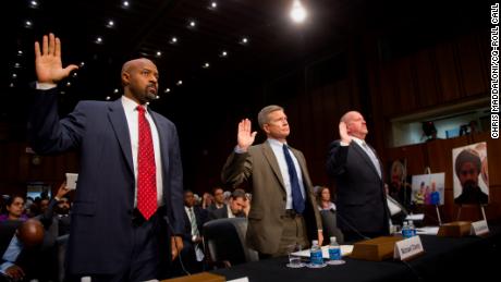 Roy Austin, left, appears in Congress during his time with the Obama administration. He remains frustrated at the nation's approach to hate crimes.