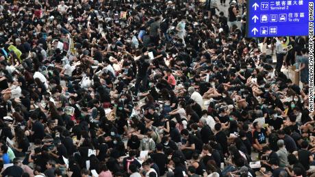 Protesters rally against a controversial extradition bill at Hong Kongs international airport on August 9, 2019.