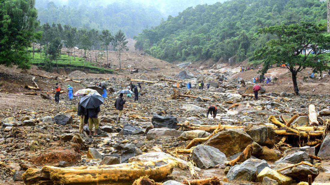 Volunteers, local residents and members of National Disaster Response Force search for survivors in the debris left by a landslide at Puthumala at Meppadi in the Wayanad district.