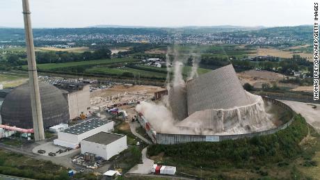 The spectacular moment the cooling tower came crashing down. 