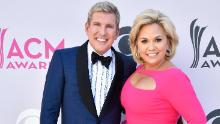 TV personalities Todd Chrisley (L) and Julie Chrisley attend the 52nd Academy Of Country Music Awards at Toshiba Plaza on April 2, 2017 in Las Vegas, Nevada.