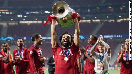 MADRID, SPAIN - JUNE 01: Mohamed Salah of Liverpool lifts the Champions League Trophy following the UEFA Champions League Final between Tottenham Hotspur and Liverpool at Estadio Wanda Metropolitano on June 01, 2019 in Madrid, Spain. (Photo by Matthias Hangst/Getty Images)