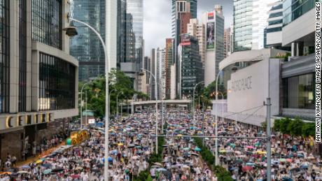 Protesters march on a street during a rally against a controversial extradition law proposal on June 9, 2019.