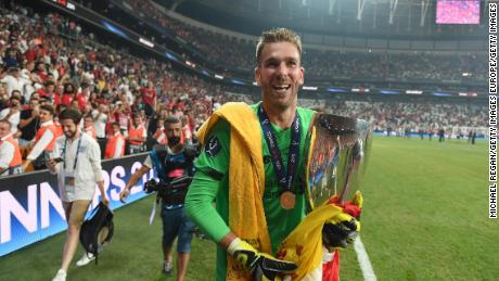 Liverpool&#39;s Adrián celebrates with the UEFA Super Cup trophy.