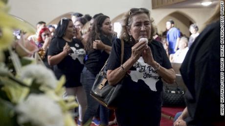 Mourners pay tribute at a public memorial for Margie Reckard,