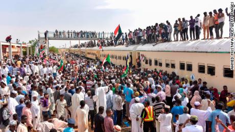 Sudanese protesters from the city of Atbara arrive in Khartoum to celebrate transition to civilian rule. 