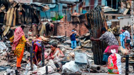 Residents search for their belongings after the fire.