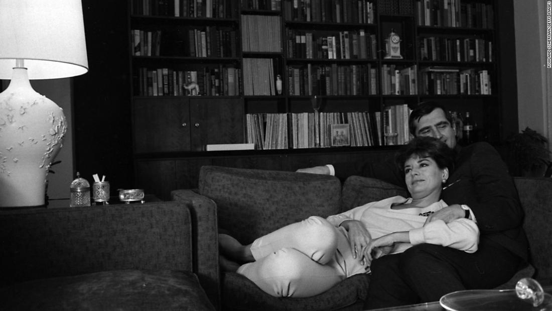 Walters relaxes with her second husband, businessman and theater producer Lee Guber, at their New York home in 1966.