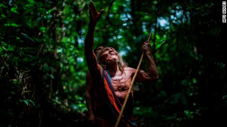 Ororiwa Waiapi walks in the forest near Mogywry village, in Amapa state. The 98-year-old leader is one of the tribe&#39;s eldest chiefs.