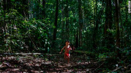 A young Ruwan Waiapi plays in the jungle. Her father, Jawaruwa Waiapi, testified before the United Nations in New York to ask for international support for Brazil&#39;s Amazon and the indigenous tribes that live in it.