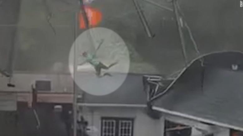 Huge Gust Of Wind Sends Man Flying Onto Roof