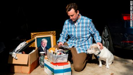 Kyle Haines and his dog Paddi visit their gutted home after in November 2017.