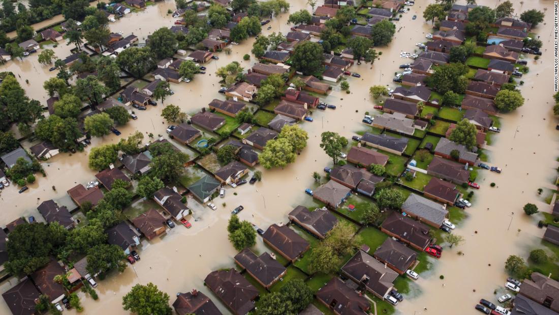 This aerial photo shows flooded residential neighborhoods in Houston.