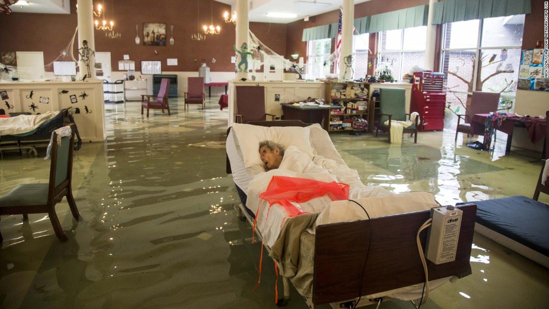 An elderly patient waits to be rescued from the Gulf Health Care Center in Port Arthur. The facility was evacuated with the help of first responders and volunteers.