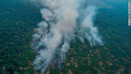 Fire consumes an area near Porto Velho, Brazil, Friday, Aug. 23, 2019. Brazilian state experts have reported a record of nearly 77,000 wildfires across the country so far this year, up 85% over the same period in 2018. Brazil contains about 60% of the Amazon rainforest, whose degradation could have severe consequences for global climate and rainfall. (AP Photo/Victor R. Caivano)