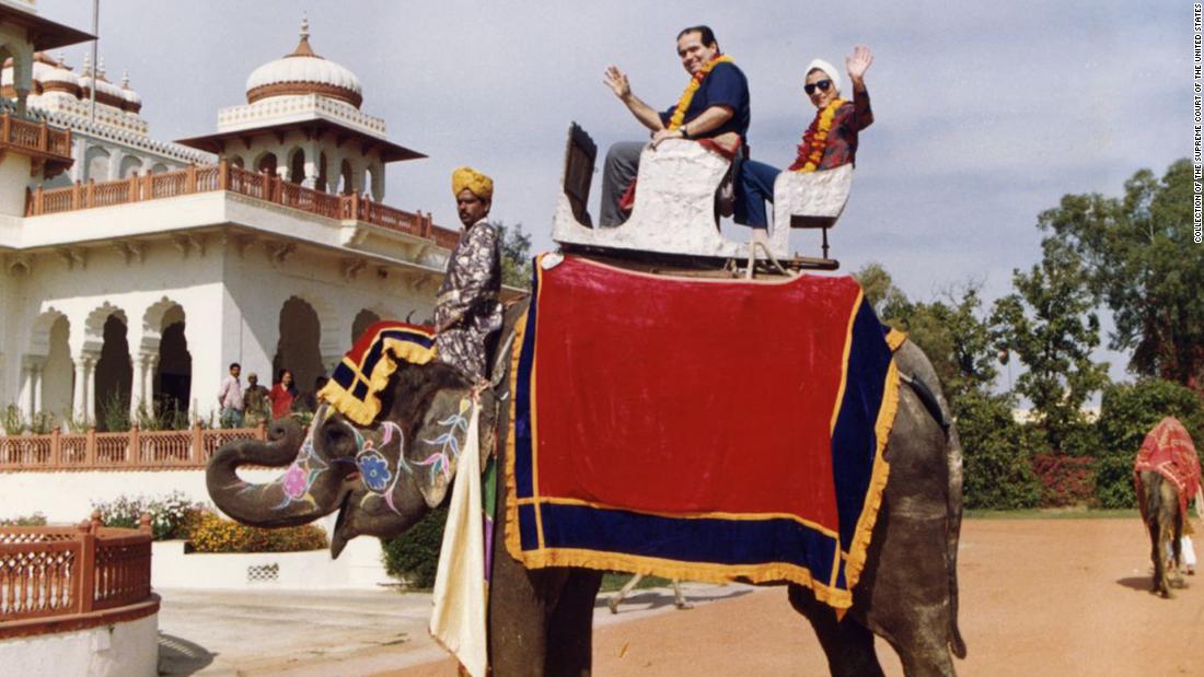 Scalia and Ginsburg pose on an elephant during their tour of India in 1994. Scalia once said they were an &quot;odd couple&quot; and he counted her as his &quot;best buddy&quot; on the bench.