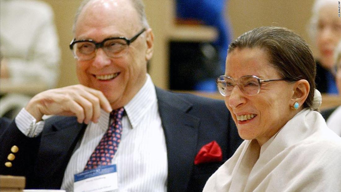 Ginsburg and her husband laugh as they listen to Supreme Court Justice Stephen Breyer speak at Columbia Law School in September 2003.