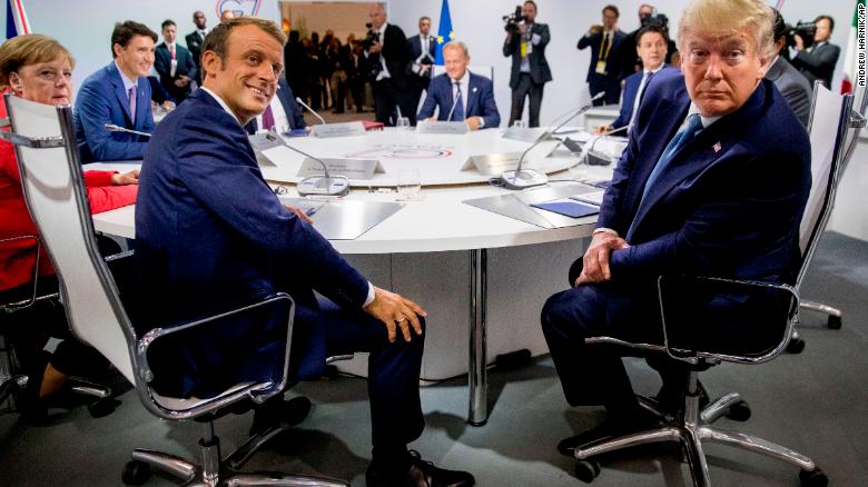 French President Emmanuel Macron, left, and President Donald Trump, right, participates in a G-7 Working Session on the Global Economy, Foreign Policy, and Security Affairs the G-7 summit in Biarritz, France, Sunday, Aug. 25, 2019. Also pictured is German Chancellor Angela Merkel, left, Canadian Prime Minister Justin Trudeau, second from left, and President of the European Council Donald Tusk, center. (AP Photo/Andrew Harnik, Pool)