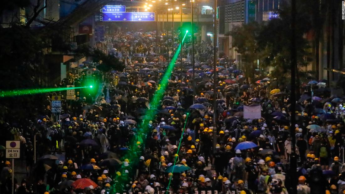 Some protesters shine laser pointers at police lines on August 25.