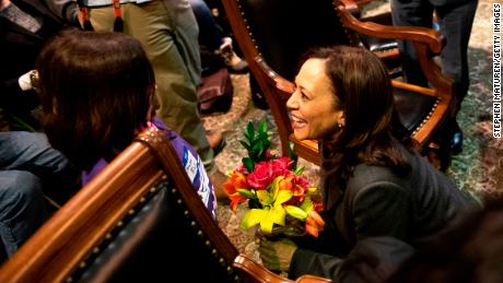 Harris said she is energized by meeting children on the trail, as here in the Iowa statehouse.