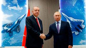 Turkish President Recep Tayyip Erdogan (L) shakes hands with his host Russian President Vladimir Putin as they visit the MAKS-2019 International Aviation and Space Salon opening day in Zhukovsky outside of Moscow on August 27, 2019. (Photo by Maxim SHIPENKOV / POOL / AFP)        (Photo credit should read MAXIM SHIPENKOV/AFP/Getty Images)