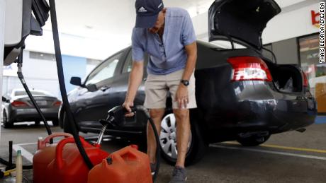 People were stocking up on gasoline, water and other supplies Tuesday in Ponce, Puerto Rico.