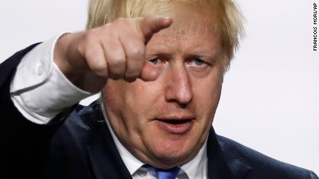 Britain's Prime Minister Boris Johnson gestures during his final press conference at the G7 summit Monday, Aug. 26, 2019 in Biarritz, southwestern France. (AP Photo/Francois Mori)