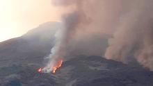 In this frame grab taken from a footage provided by the Italian Firefighters, smoke billows from the volcano on the Italian island of Stromboli, Wednesday, Aug. 28, 2019.