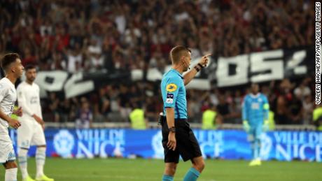 French referee Clement Turpin halts the game in Nice Wednesday.