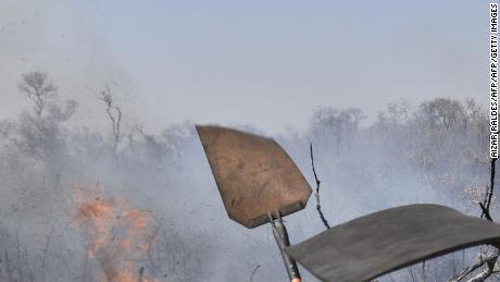 Firefighters try to control a fire near Charagua, Bolivia, on August 29, 2019.