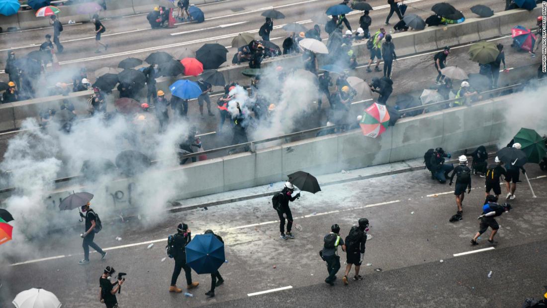 An overhead view shows protesters reacting after police fired tear gas on August 31.