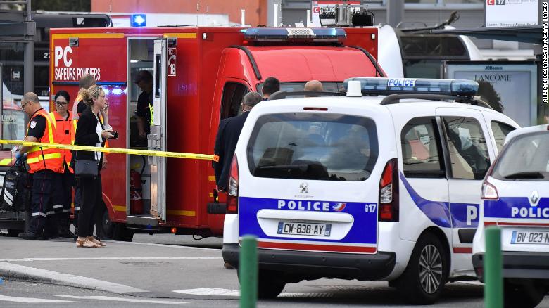 Emergency services at work on the outskirts of Lyon after a deadly knife attack.