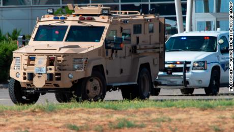 Police and sheriff&#39;s deputies surround the area behind Cinergy movie theater in Odessa, Texas. 