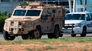 CORRECTS THE NAME OF THE SOURCE TO THE MIDLAND REPORTER-TELEGRAM - Odessa and Midland police and sheriff's deputies surround the area behind Cinergy movie theater in Odessa, Texas, Saturday, Aug. 31, 2019, after reports of gunfire. Police said there are "multiple gunshot victims" in West Texas after reports of gunfire on Saturday in the area of Midland and Odessa. (Tim Fischer/Midland Reporter-Telegram via AP)