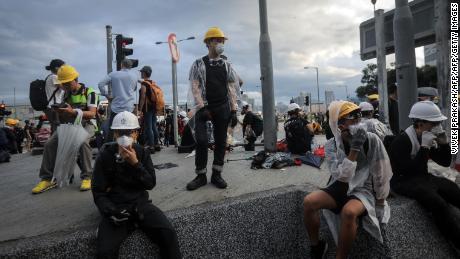 Protesters stand behind barricades outside the government headquarters the morning of July 1.