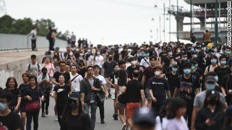 Crowds of protesters head from Hong Kong international airport to nearby Tung Chung.