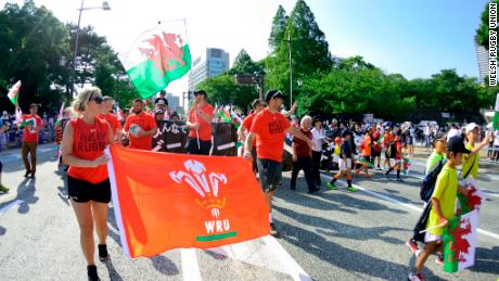 Welsh flags are carried through Kitakyushu.