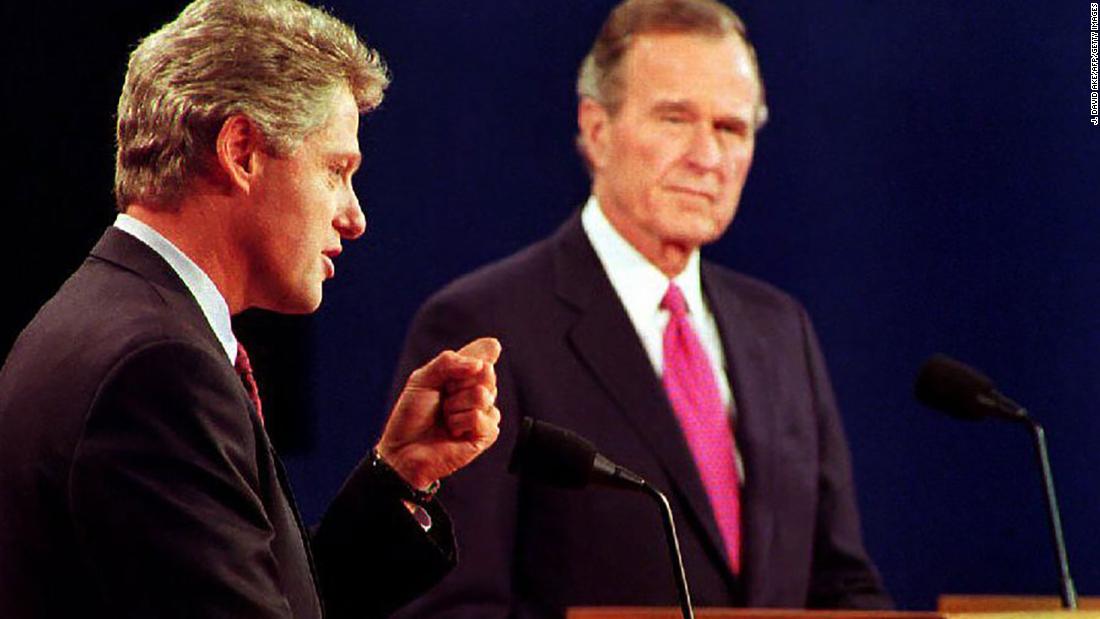 Clinton debates President George H.W. Bush and independent candidate H. Ross Perot, not pictured, in October 1992. It was their third and final debate.