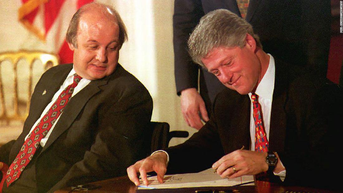 James Brady, the Reagan administration press secretary who was wounded during a 1981 assassination attempt, watches Clinton sign the Brady Bill at the White House in November 1993. The bill required a five-day waiting period for handgun purchases.
