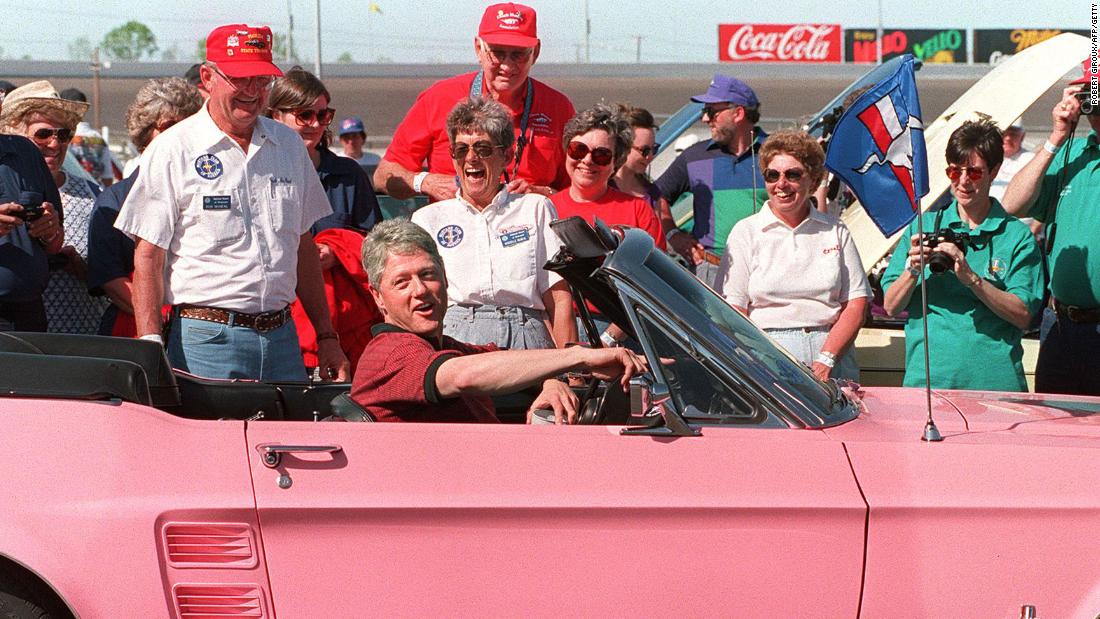 Clinton sits in a 1967 Ford Mustang while visiting the Charlotte Motor Speedway in North Carolina in April 1994.