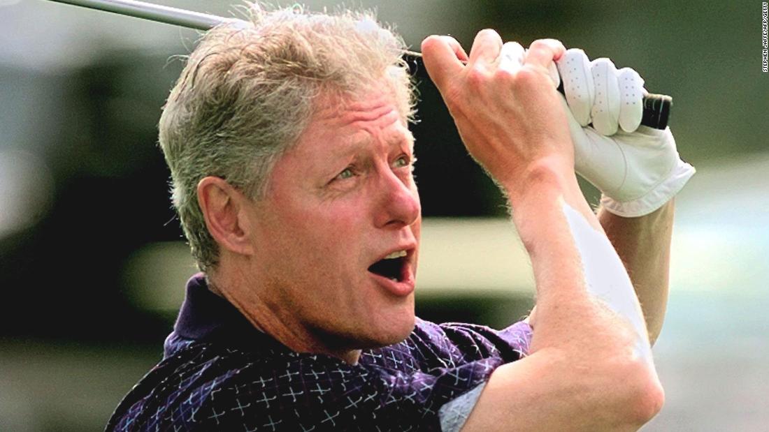 Clinton tees off while playing golf at Martha&#39;s Vineyard in Massachusetts in August 1997.