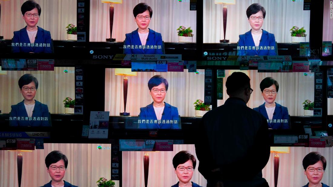 A man watches televisions at a store in Hong Kong as Chief Executive Carrie Lam announces the withdrawal of the extradition bill on Wednesday, September 4.