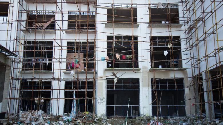 On construction sites, workers live in the half-constructed buildings, a major safety hazard.