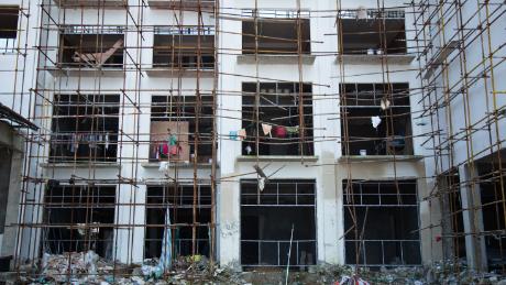 On construction sites, workers live in the half-constructed buildings, a major safety hazard.