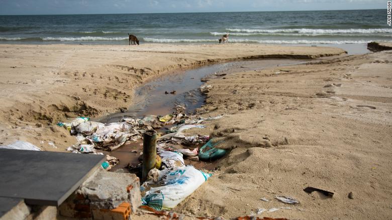 Raw sewage flows straight into the sea. The beach is also littered with plastic.