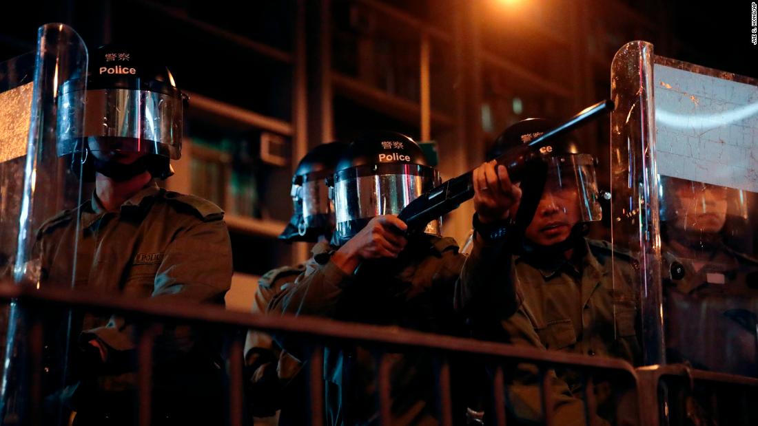 Police aim at protesters outside the Mong Kok police station on September 4.